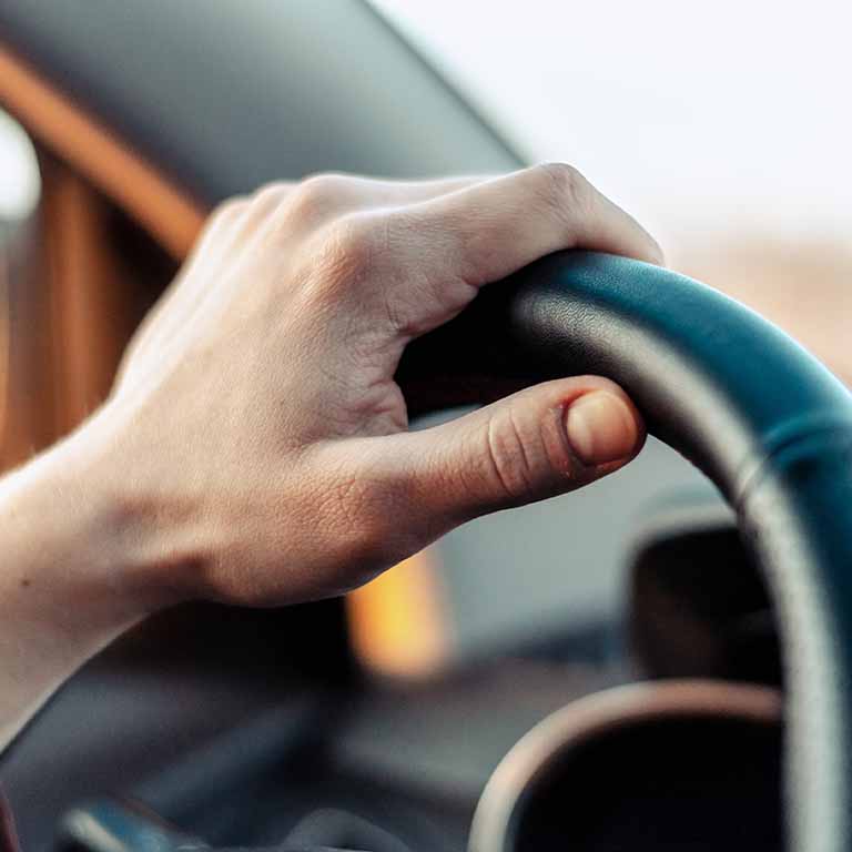 Hand On Steering Wheel