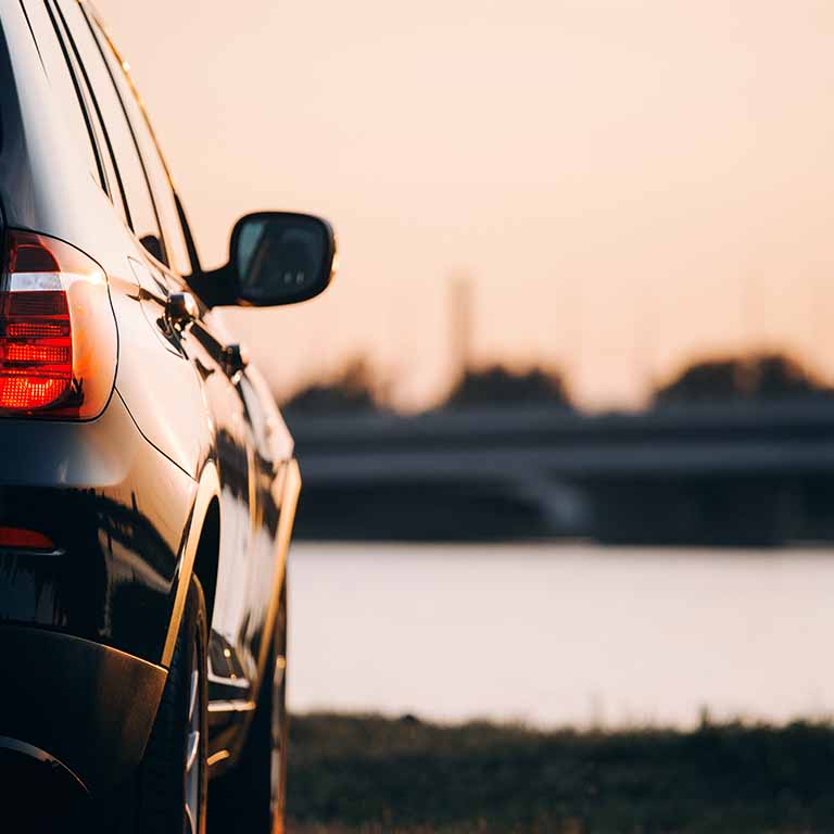 Back Of Car Facing Sunset