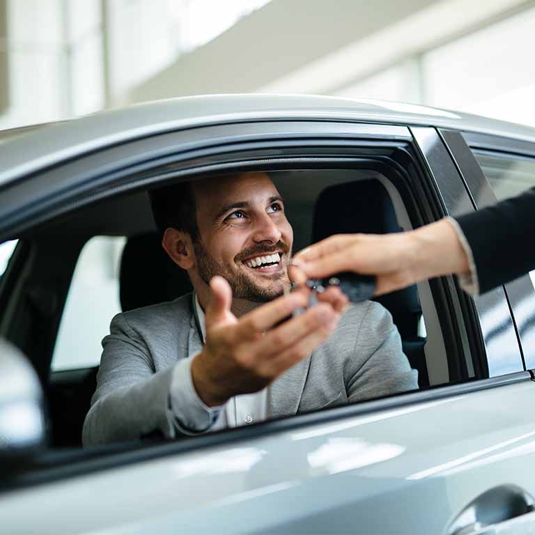 Happy Man Getting Handed Keys