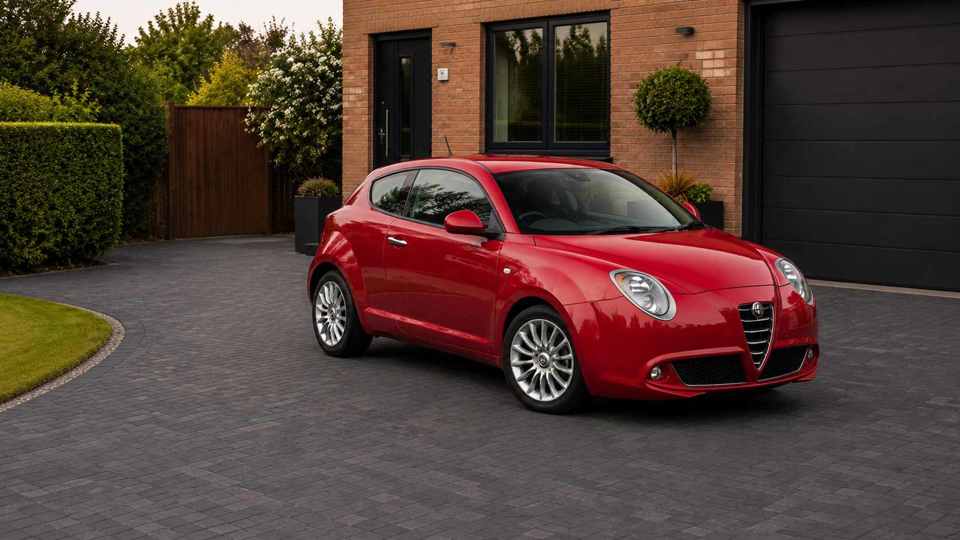 Red Alfa Romeo Mito parked on a driveway