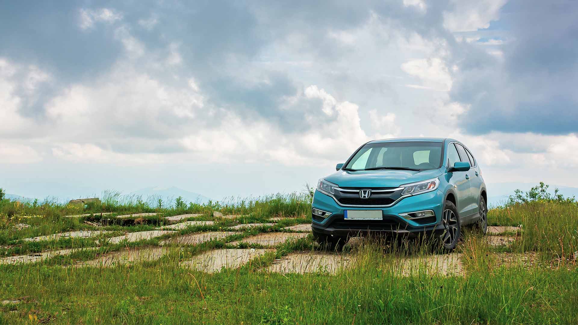 Blue Honda Driving Across Grass ?? 